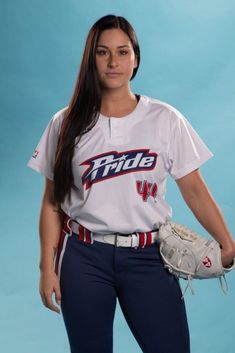 a female baseball player is posing for a photo