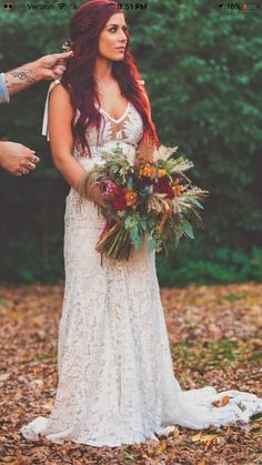 the bride is getting ready to walk down the aisle