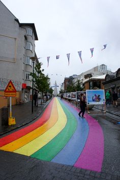 there is a rainbow painted street in the middle of town