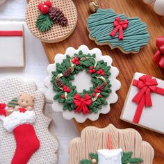 decorated christmas cookies on a table with decorations