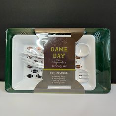 a game day tray with forks, spoons and cups in the package for serving