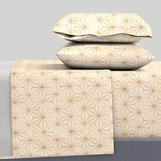 three pillows stacked on top of each other