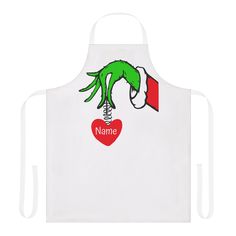 a white apron with an image of a green hand holding a red heart and name on it