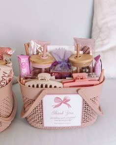 two pink baskets filled with personal care items