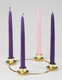 three candles are arranged in the shape of a circle