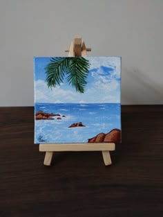 a small easel with a painting on it