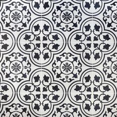 a black and white tile with an intricate design