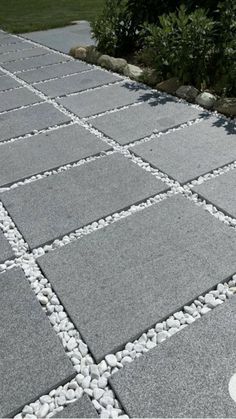 a walkway made out of stones and gravel