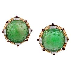 Jade has been regarded historically by the Chinese as the "stone of heaven,” prized above diamonds, and considered to be a metaphor for longevity, wisdom, and purity. The Mandarin character for jade, or you, has two meanings: "imperial” and "heaven” - symbolizing the link between heaven and earth. These David Webb Ancient World Vintage Carved Jade Button Earrings have the quality of significant artifacts yet, at the same time, are imbued with his dazzling colorful style and updated Art Deco glam Art Chinois, Chinese Jade, David Webb, Mythical Animal, American Jewelry, Jade Earrings, Button Earrings, Jade Carving, Chinese Culture