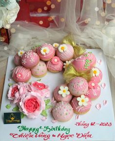 a birthday card with pink and white decorated cupcakes in the shape of a heart