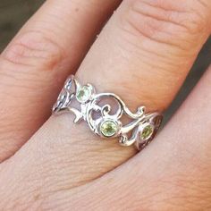 Beautiful 14k white gold ring set with three green peridot. Personally, paisley is one off my favorite shapes. It inspired me to create a piece, which would be full of air, romantic and beautiful. A 14k yellow gold ring, set with three beautiful 2.5 mm green peridot. Will make a beautiful gift for you or your loved ones.  ----------------------------------------------------------------- * Can be set with any other color of stones that you choose.  ------------------------------------------------ White Gold Peridot Rings With Prong Setting, Elegant Peridot Gemstone Stackable Rings, Three Stone Peridot Jewelry As Gift, White Gold Peridot Rings For Wedding, Peridot Three Stone Jewelry As Gift, Anniversary White Gold Peridot Jewelry, Anniversary Peridot Jewelry In White Gold, Elegant White Gold Ring With Peridot, Three Stone Peridot Ring