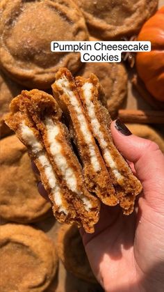 pumpkin cheesecake cookies are being held up in front of the camera