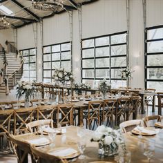 an indoor wedding venue with tables and chairs