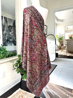 A premium quality super soft Kashmiri Kani shawl is a luxurious wrap known for its intricate patterns and delicate craftsmanship. Made from fine wool, it boasts a velvety texture that feels soft against the skin. The shawl features traditional Kashmiri designs woven using the Kani technique, which involves meticulous Kani-weaving with small sticks, resulting in a beautifully detailed and vibrant fabric. Ideal for both warmth and style, this shawl is a timeless accessory for any wardrobe. Measure Festive Shawl With Traditional Patterns, Pink Pashmina Shawl Scarf, Festive Shawl Scarves With Traditional Patterns, Pashmina Shawl With Traditional Patterns, Jamawar Shawl Dupatta, Jamawar Dupatta Shawl, Bohemian Shawl With Sheer Dupatta, Pashmina Scarves With Traditional Patterns, Traditional Pashmina Scarf With Traditional Patterns