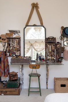 an image of a room with many items on the wall and in front of a mirror