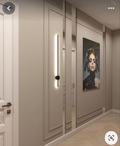 an image of a woman's face is on the wall next to some doors