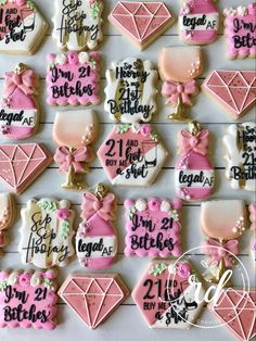 the cookies are decorated with pink and white icing on top of each other in different designs