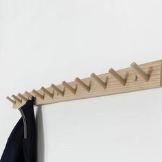 a coat rack with clothes hanging on it