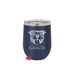 a blue wine tumbler with a dog's face on it and the word grace written