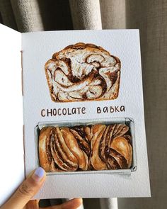 a person holding up a card with some bread on it and the words chocolate bake