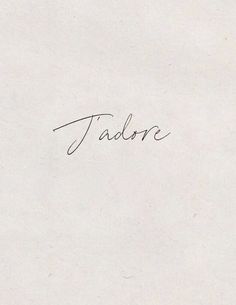 a piece of paper with the word jadore written in cursive writing