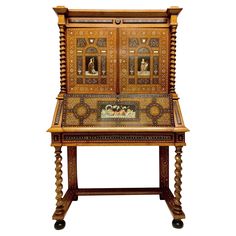 an old wooden desk with intricate carvings on the front and sides, sitting against a white background