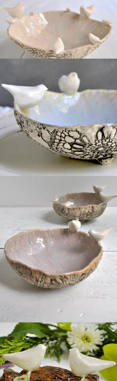 three bowls with different designs on them and one has white flowers in the middle, while another is brown