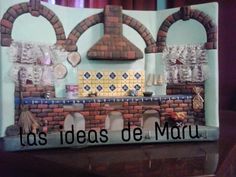 this is an image of a miniature kitchen made out of bricks and paper machs