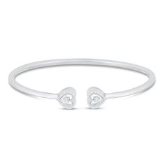 This charming bangle bracelet for her adds a touch of sparkle to her wrist and can be layered with other bracelets or worn alone. The sterling silver bangle features a heart-shaped design at each end, each shimmering in 1/10ctw. Heart Bangle Bracelet, Bracelet For Her, Sweet 16 Gifts, Sterling Silver Bangle, Kay Jewelers, Sterling Silver Bangles, Silver Bangle, Silver Bangles, Diamond Heart