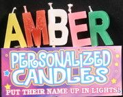 personalized candles are placed on top of each other