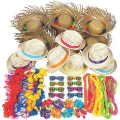 several hats, sunglasses and leis are laid out on a white background