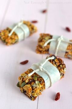 three granola bars wrapped in white paper and tied with string