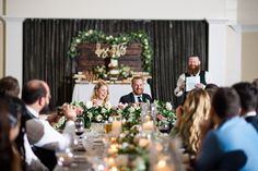 a group of people sitting around a table