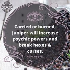 a glass jar filled with blackberries next to a sign that says carried or burned, juniper will increase psychic powers and break hex