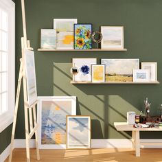 there are many pictures and paintings on the wall in this room with easel, paintbrush, watercolors, and other items