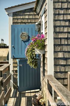 a blue door is on the side of a house