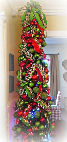 a christmas tree decorated with green and red ornaments