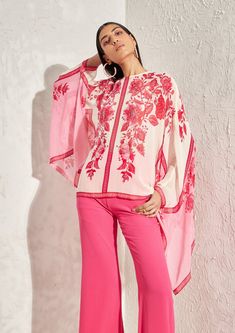 Editor's Note The pink eden kaftan top features a loose and flowy silhouette, with floral hand embellishment detailing. It is perfect for a relaxed yet stylish look and can be paired with trousers or a skirt. Note: Pants worn by model is for styling purposes only Color: Pink Fabric: Crepe Component: Kaftan top Occasion: Daywear and resort Embroidery: Floral hand & machine embellishment Disclaimer: Product color may slightly vary due to photographic lighting sources or your monitor setting. Care: Summer Pink Kaftan With Printed Motifs, Festive Pink Embroidered Kaftan, Festive Pink Kaftan With Printed Motifs, Traditional Pink Floral Print Kaftan, Embroidered Pink Floor-length Kaftan, Kaftan Top, Personal Shopping Service, Color Pairing, Photographic Lighting