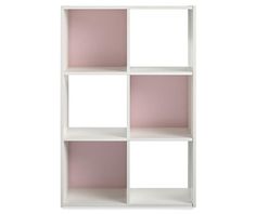 a white and pink shelf unit with four sections on the top, one section is empty