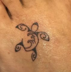 a woman's foot with a tattoo on it