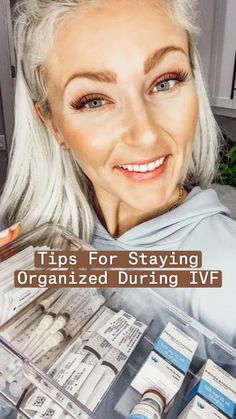 an older woman with white hair and blue eyes is holding up some medicine bottles