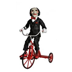 a creepy clown riding a red bike with wheels