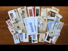 many different types of cards and envelopes on a table