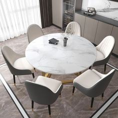 a dining room table with chairs around it