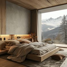 a large bed sitting next to a window with mountains in the backgroung