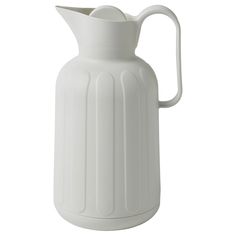 a white ceramic pitcher on a white background