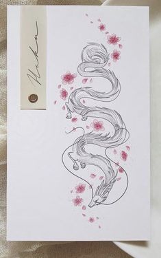 a card with an ink drawing of a woman's hair and flowers on it