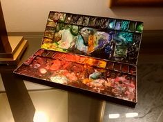 an artist's palette sitting on top of a table