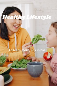 a woman and child sitting at a table eating salad together with the caption healthy lifestyle to learn more, link in bio