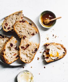 slices of bread on a plate with butter and honey